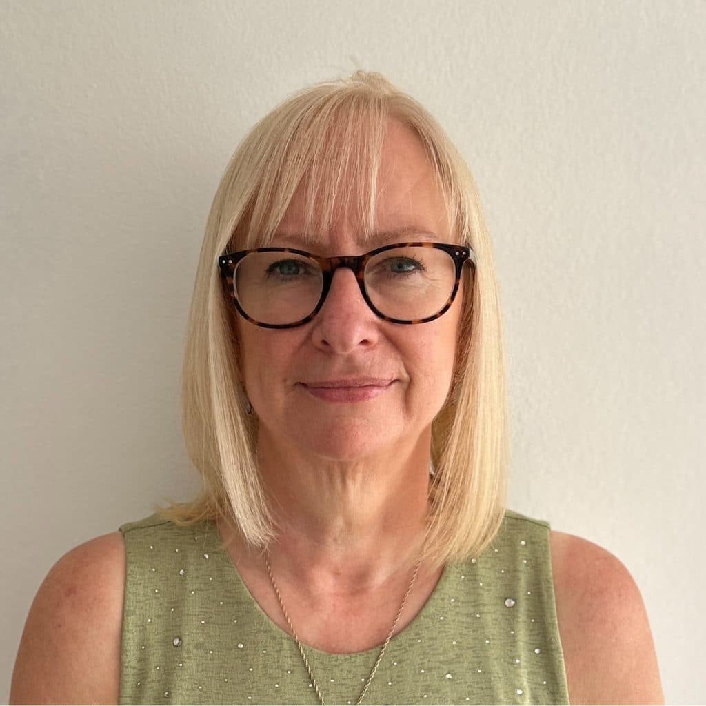 A photo of Jo Beer. She is facing the camera and smiling.